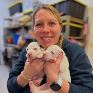 Vet Staff holding puppies